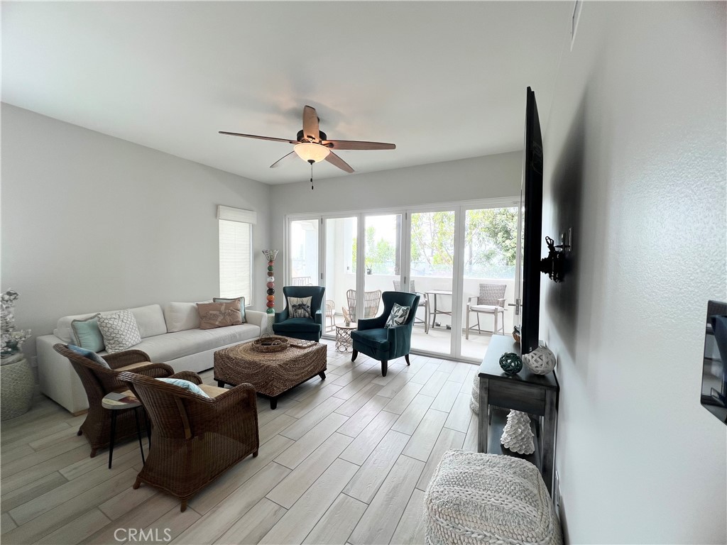 1519 Doheny Way Dana Point, CA 92629 - Photo 9 of 23 a living room with furniture and large windows