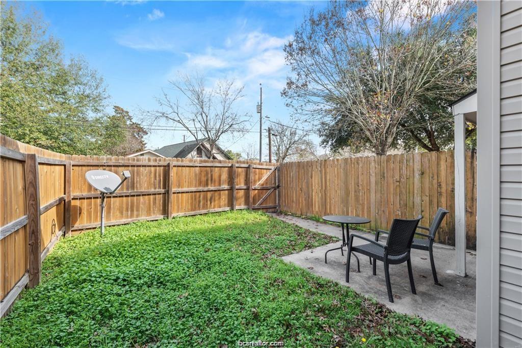 1229 Oney Hervey Drive College Station, TX 77840 - Photo 22 of 22 a view of backyard with deck and wooden fence
