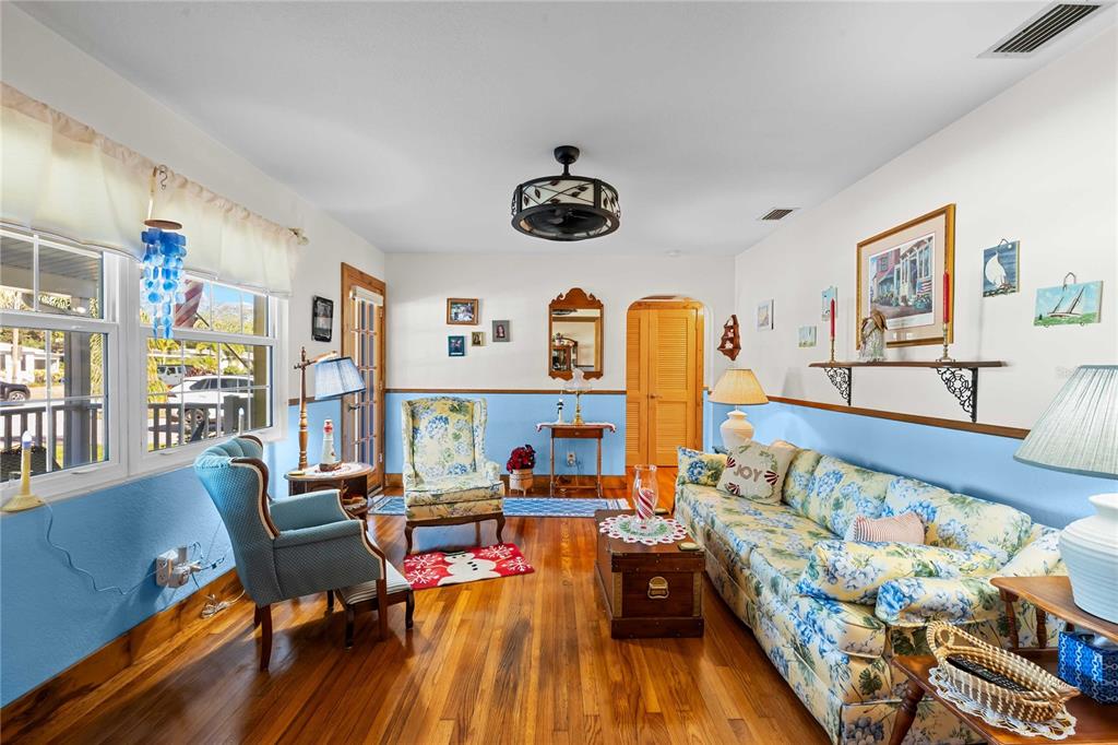 1109 Commodore Street Clearwater, FL 33755 - Photo 16 of 42 a living room with furniture and wooden floor