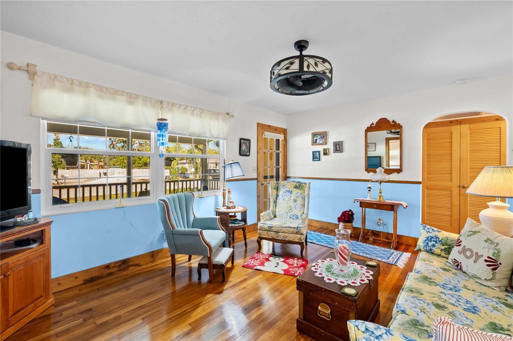 1109 Commodore Street Clearwater, FL 33755 - Photo 17 of 42 a living room with furniture and a flat screen tv