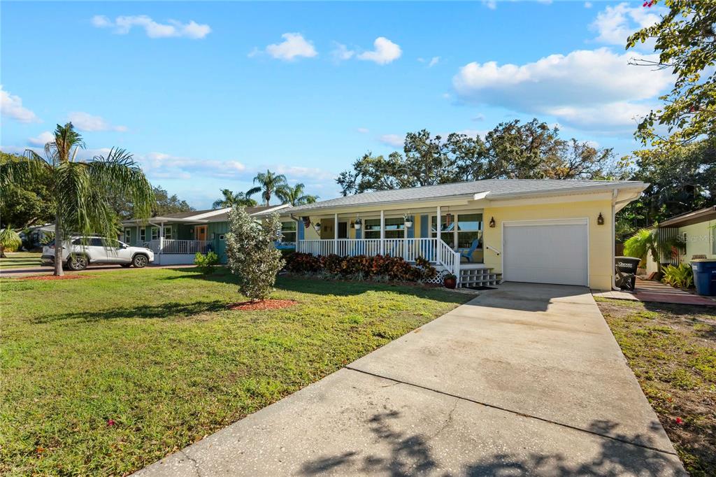 1109 Commodore Street Clearwater, FL 33755 - Photo 2 of 42 a view of a house with a patio