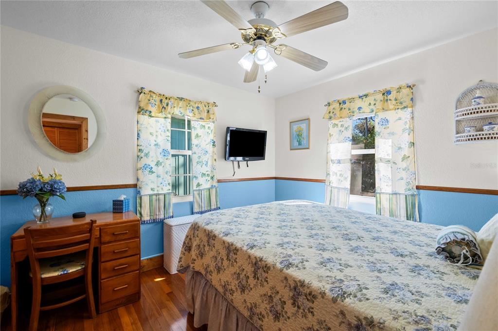 1109 Commodore Street Clearwater, FL 33755 - Photo 26 of 42 a bedroom with a bed and a television