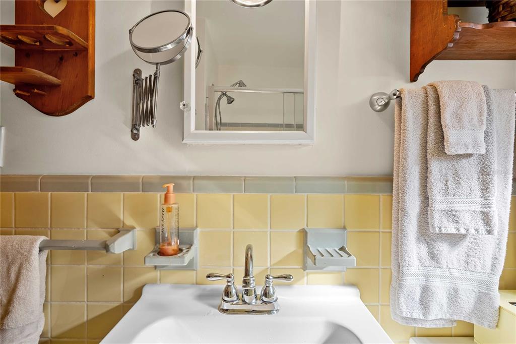 1109 Commodore Street Clearwater, FL 33755 - Photo 28 of 42 a bathroom with a sink and a mirror