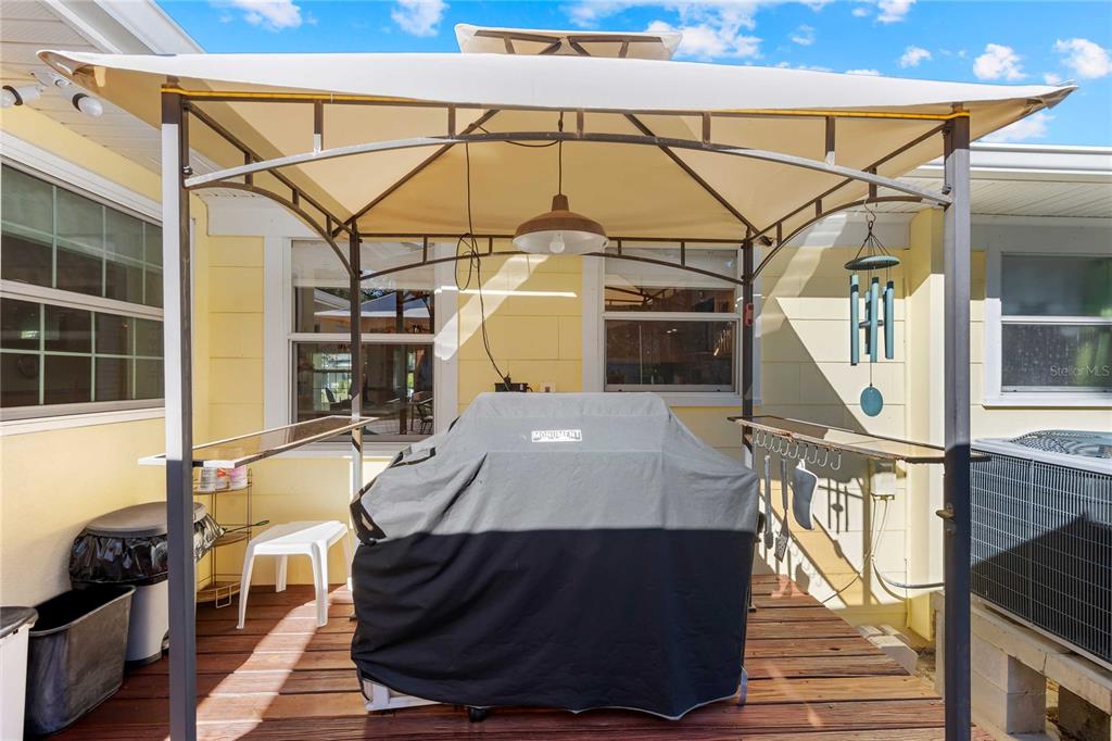 1109 Commodore Street Clearwater, FL 33755 - Photo 32 of 42 a view of a patio with table and chairs