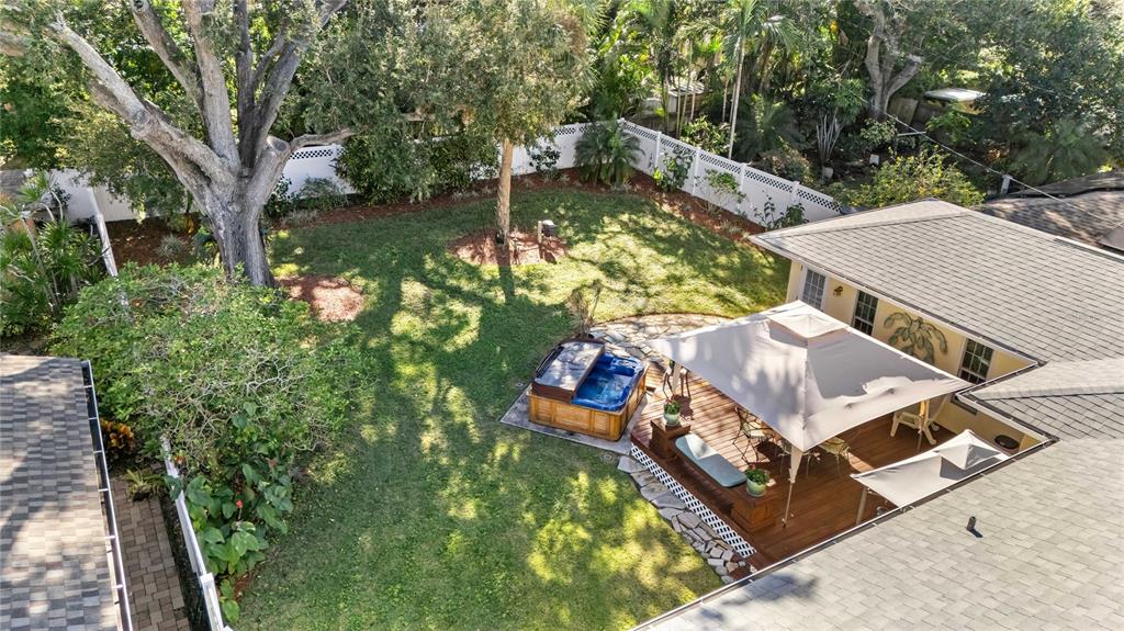 1109 Commodore Street Clearwater, FL 33755 - Photo 38 of 42 an aerial view of a house with swimming pool and large trees