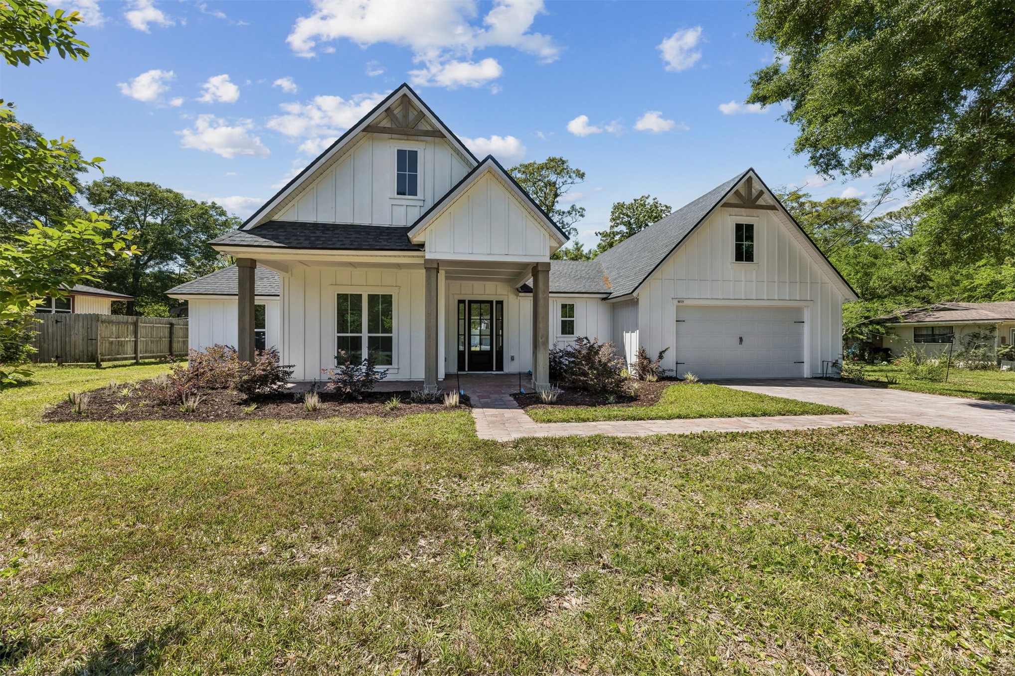 95121 North Ellis Landing Road Fernandina Beach, FL 32034 - Photo 1 of 37 a front view of house with yard and green space