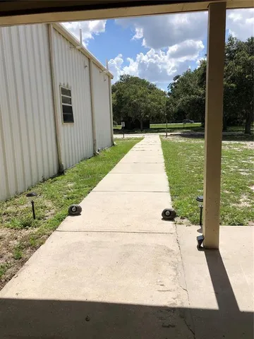 a view of a back yard of the house