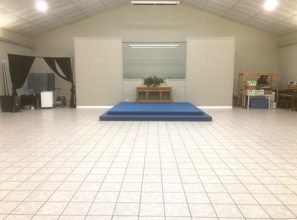 14920 Balm Wimauma Road Wimauma, FL 33598 - Photo 7 of 20 a bedroom with a bed and a lamp on dresser