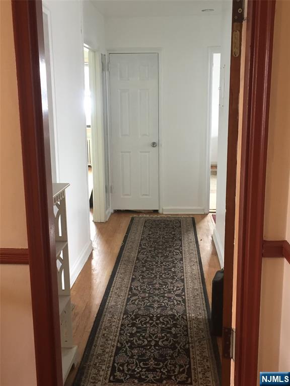418 Main Street, Unit D6 Fort Lee, NJ 07024 - Photo 3 of 7 a view of hallway with wooden floor