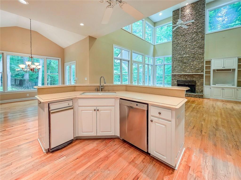 3712 Frederica Road Northwest Berkeley Lake, GA 30096 - Photo 18 of 49 a kitchen with a sink stove and cabinets