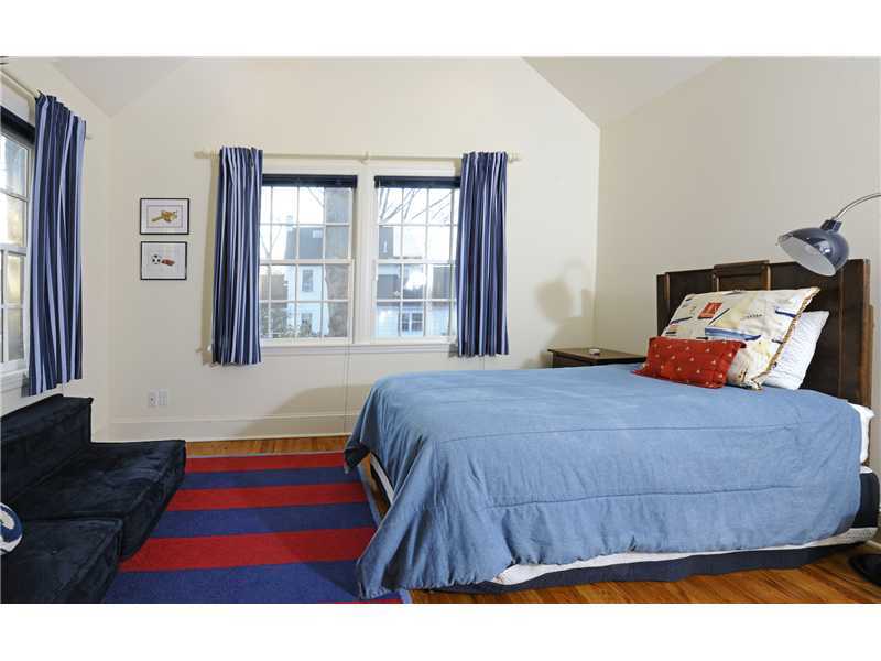 Undisclosed Address Riverside, CT 06878 - Photo 12 of 19 a bedroom with a bed and a window