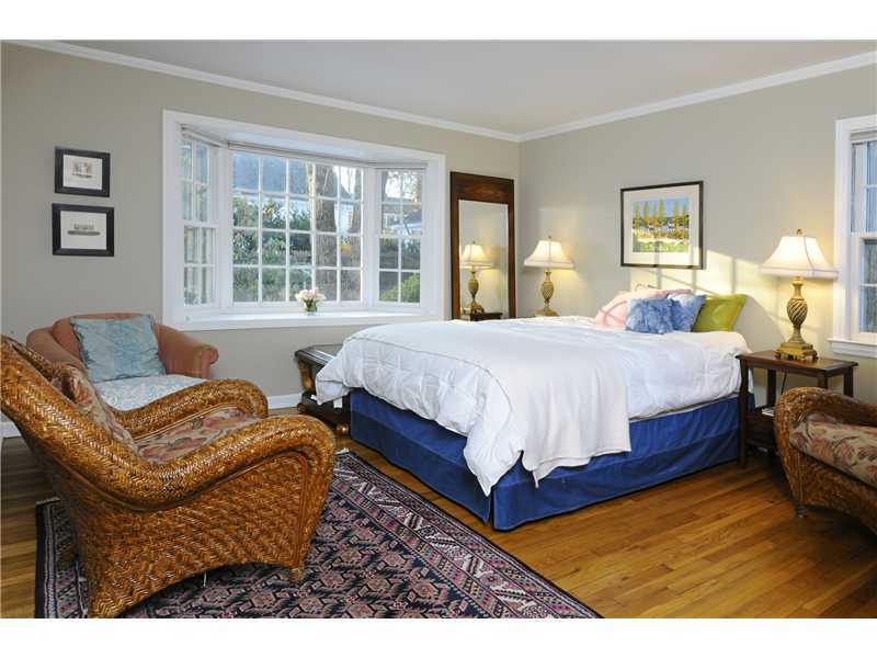 Undisclosed Address Riverside, CT 06878 - Photo 13 of 19 a bedroom with a bed and window