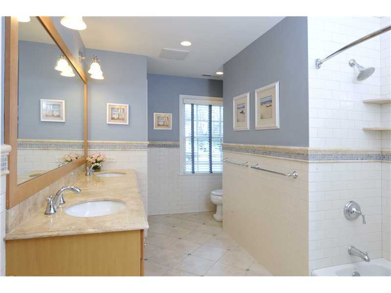 Undisclosed Address Riverside, CT 06878 - Photo 14 of 19 a bathroom with a sink and a mirror