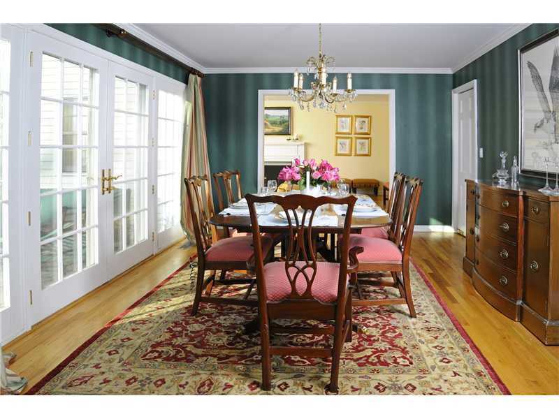 Undisclosed Address Riverside, CT 06878 - Photo 3 of 19 a view of a dining room with furniture a chandelier and wooden floor