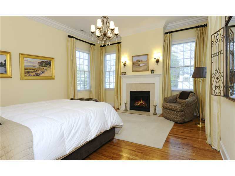 Undisclosed Address Riverside, CT 06878 - Photo 10 of 19 a spacious bedroom with a bed and a fireplace