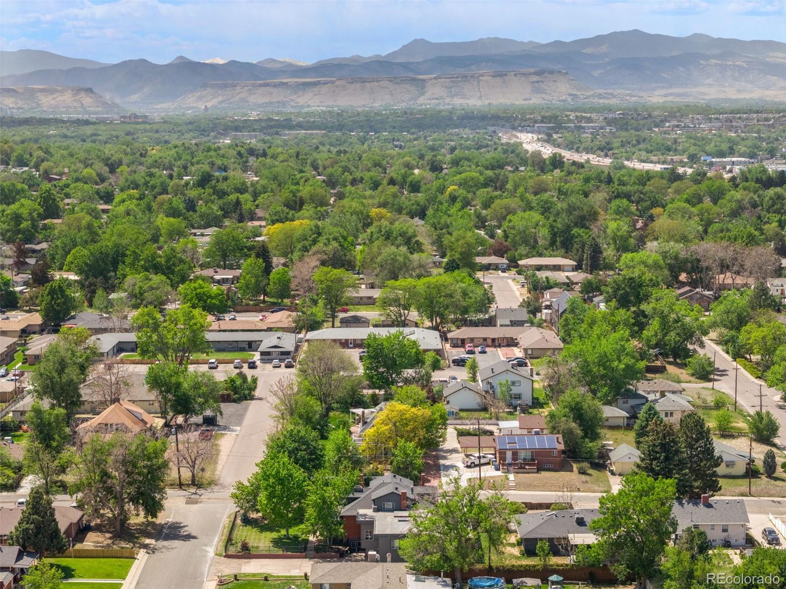 6595 West 46th Place Wheat Ridge, CO 80033 - Photo 46 of 48 an aerial view of residential house with outdoor space and mountain view
