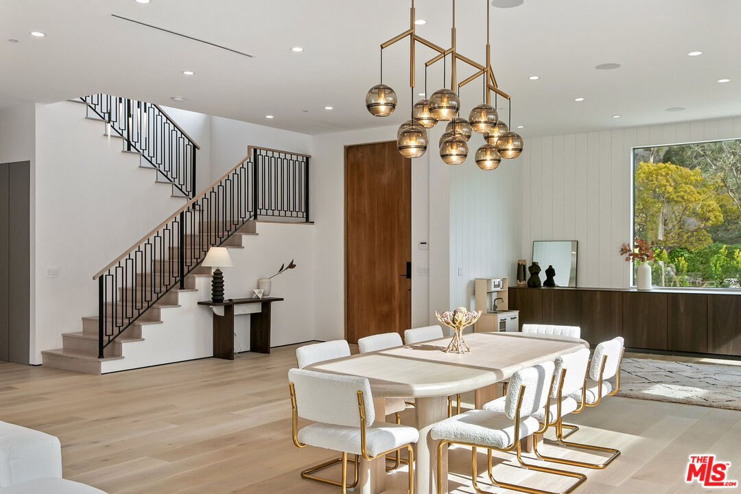 211 Veteran Avenue Los Angeles, CA 90024 - Photo 12 of 51 a view of a dining room with furniture window and wooden floor