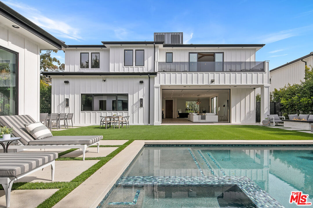 211 Veteran Avenue Los Angeles, CA 90024 - Photo 2 of 51 a view of a house with pool and a yard