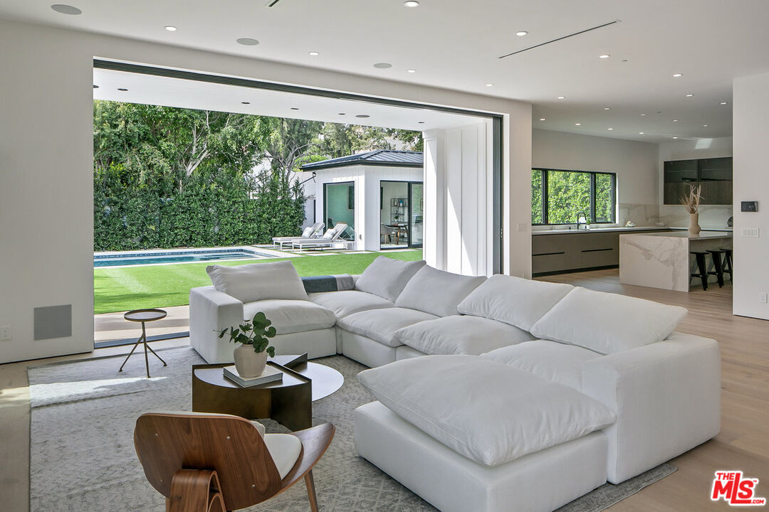 211 Veteran Avenue Los Angeles, CA 90024 - Photo 21 of 51 a living room with furniture and a large window
