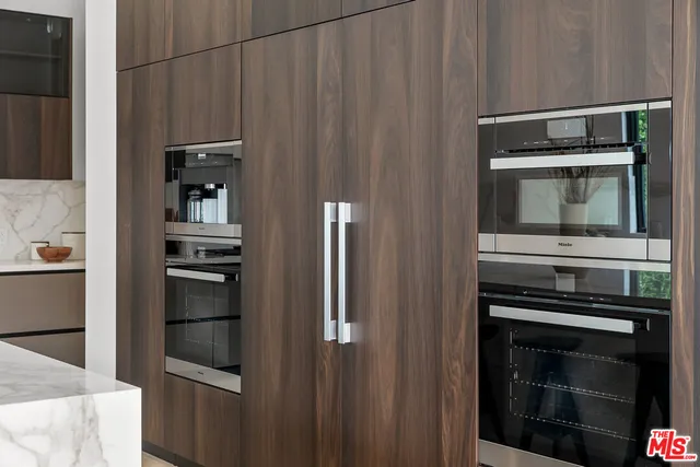 a kitchen with appliances and cabinets