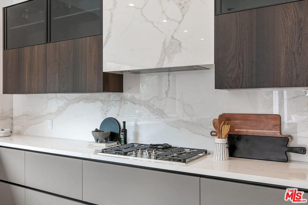 211 Veteran Avenue Los Angeles, CA 90024 - Photo 29 of 51 a kitchen with a cabinets and a stove top oven