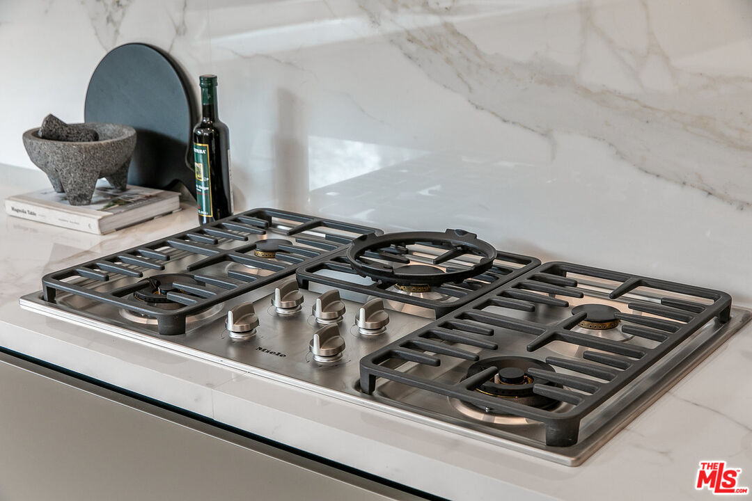 211 Veteran Avenue Los Angeles, CA 90024 - Photo 30 of 51 a stove top oven sitting inside of a kitchen