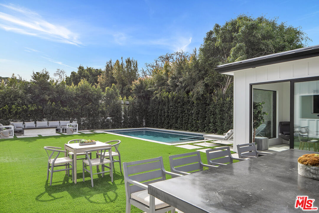 211 Veteran Avenue Los Angeles, CA 90024 - Photo 31 of 51 a view of a swimming pool with a patio