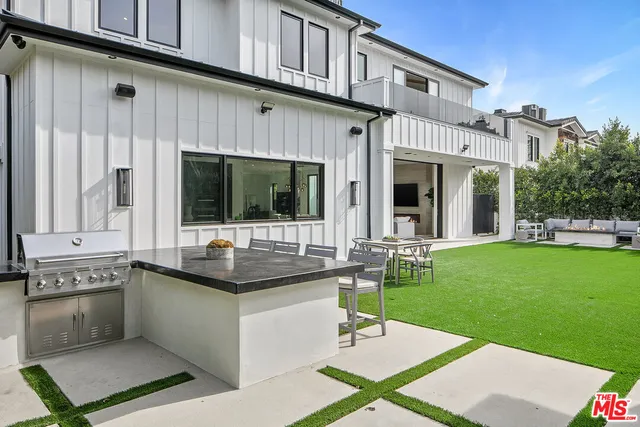 a view of a chairs and table in the patio