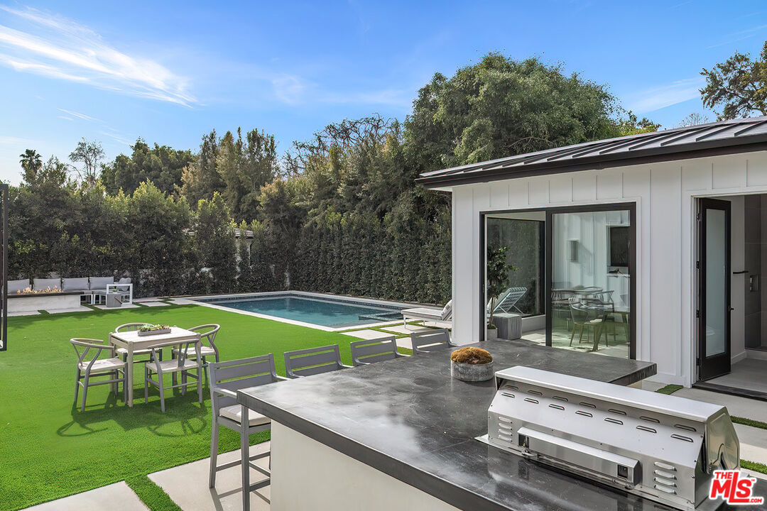 211 Veteran Avenue Los Angeles, CA 90024 - Photo 35 of 51 a view of a house with backyard patio and swimming pool