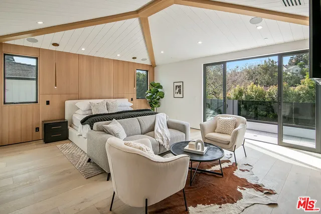 a living room with fireplace furniture and a flat screen tv