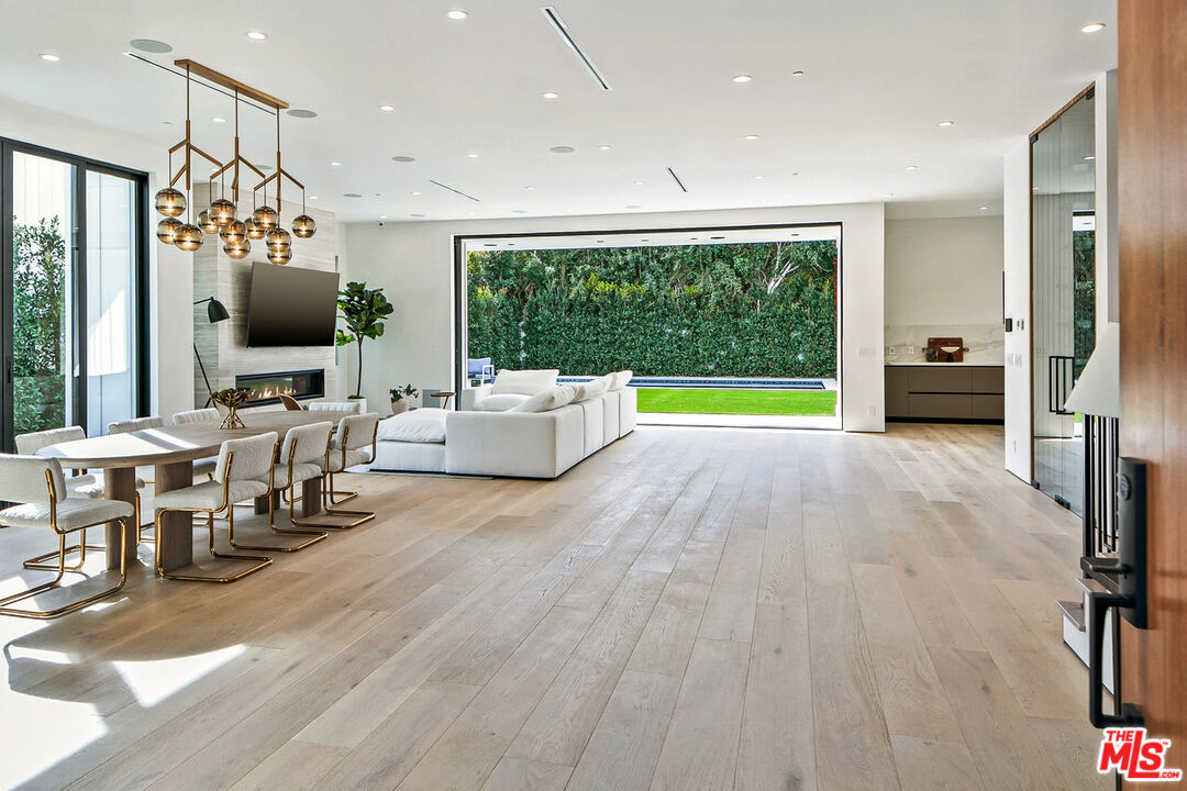 211 Veteran Avenue Los Angeles, CA 90024 - Photo 5 of 51 a living room with furniture and a flat screen tv