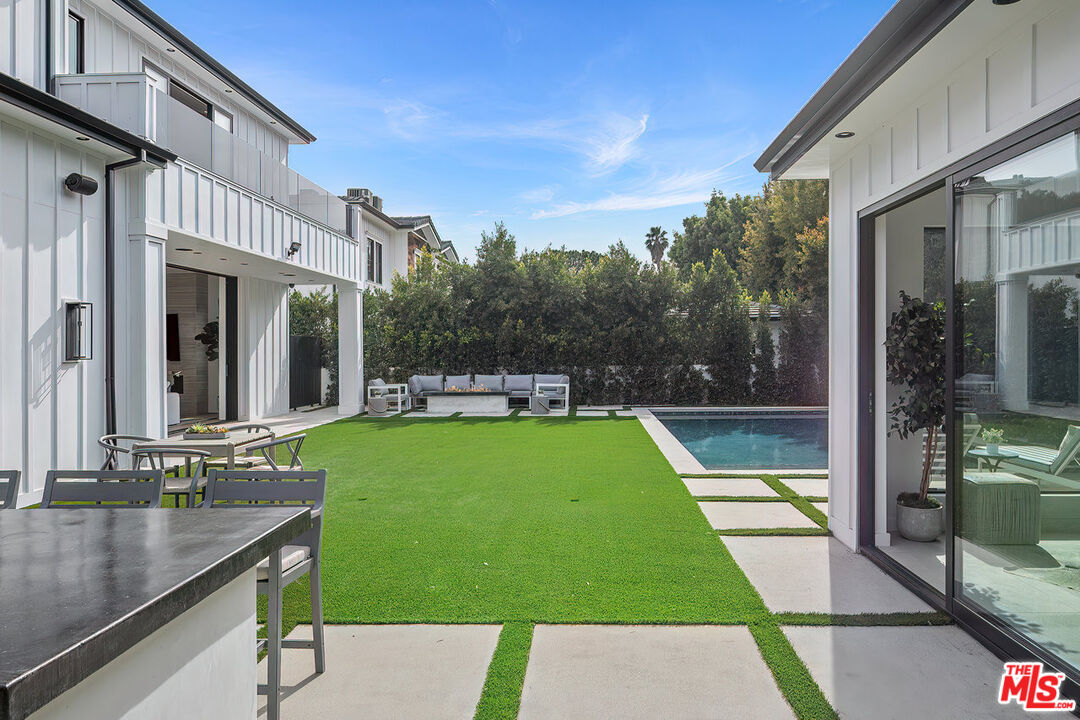 211 Veteran Avenue Los Angeles, CA 90024 - Photo 51 of 51 a view of backyard with swimming pool and outdoor seating