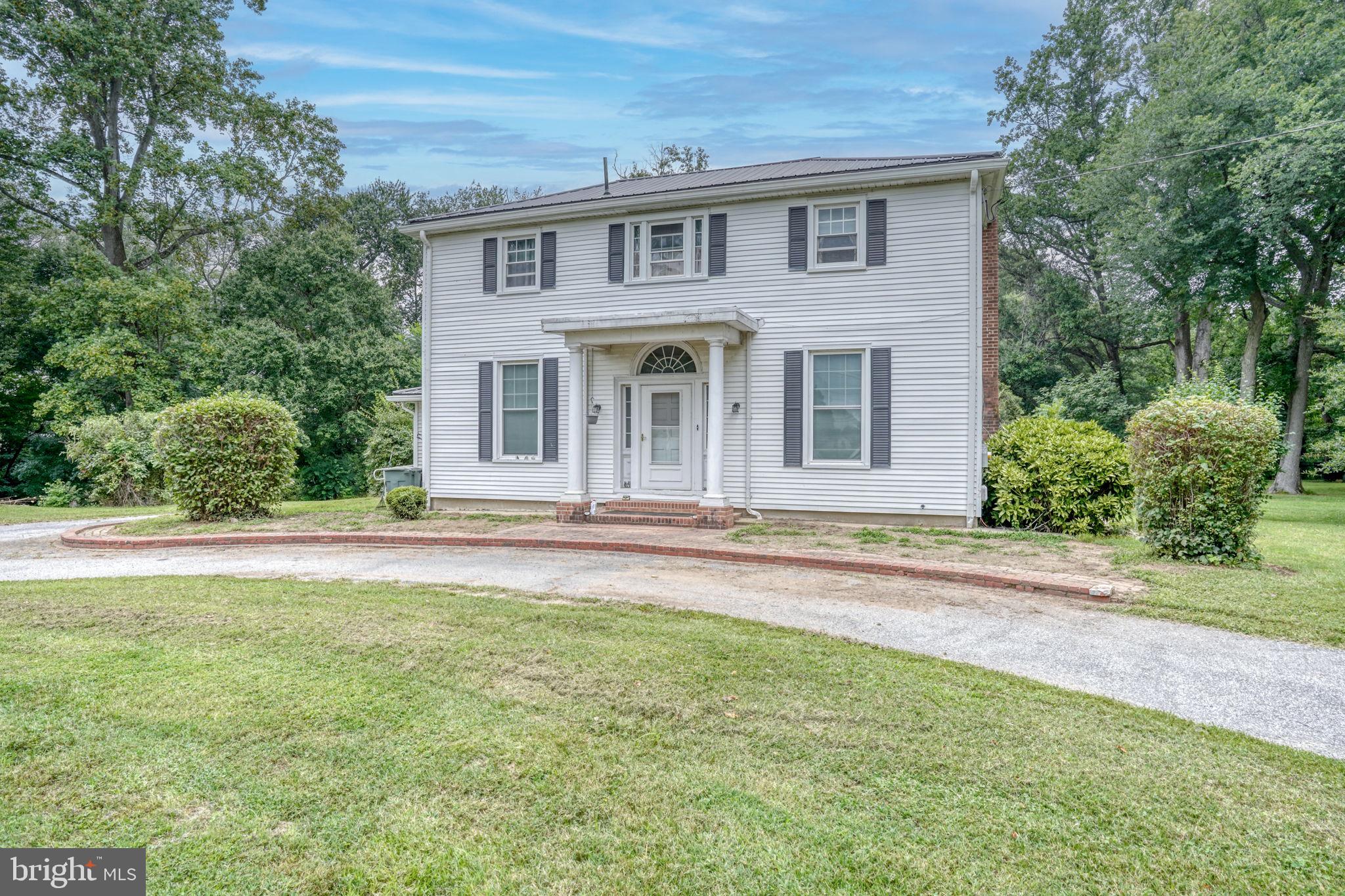 5321 Millington Road Clayton, DE 19938 - Photo 16 of 44 a front view of a house with a garden