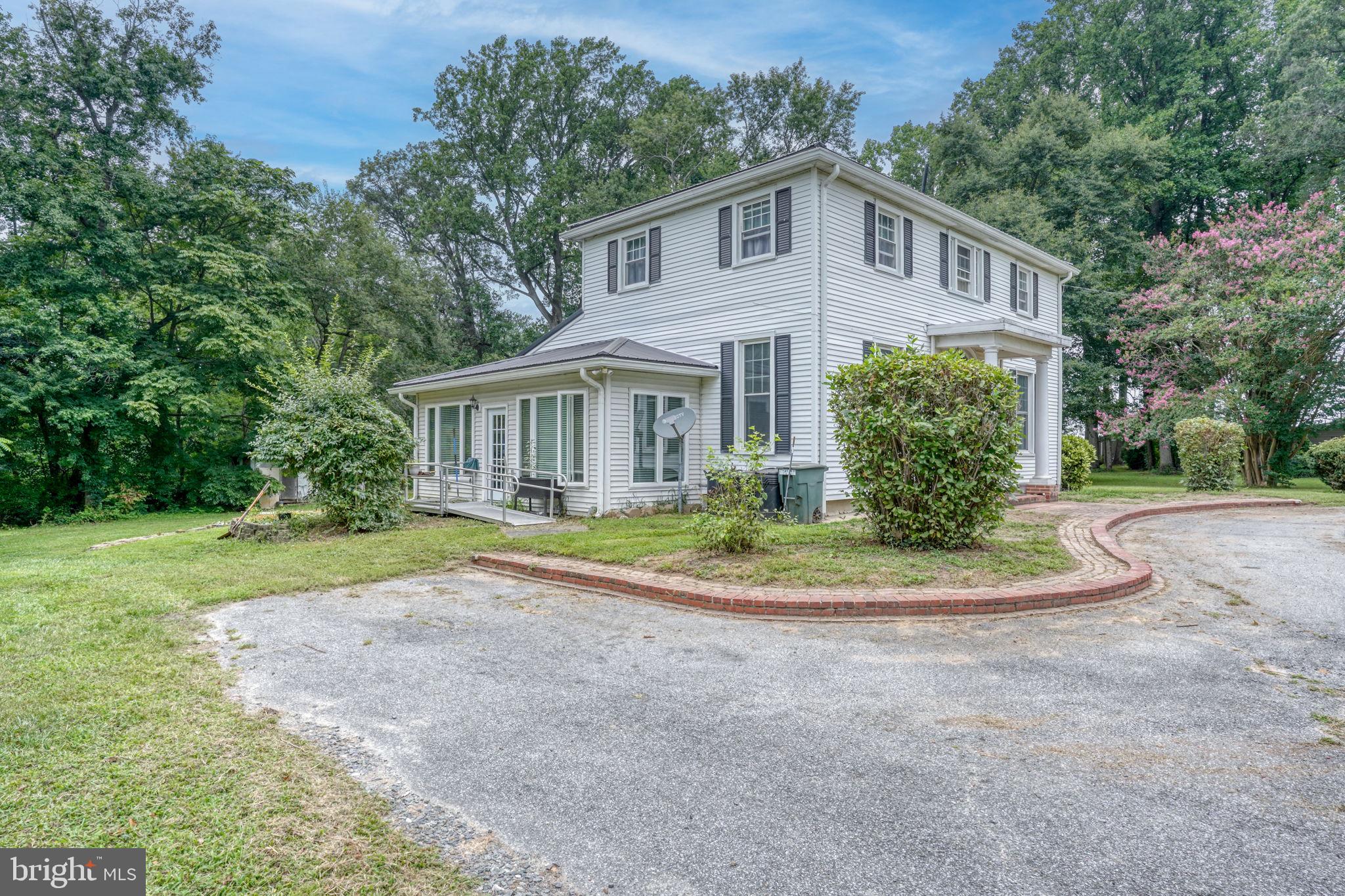 5321 Millington Road Clayton, DE 19938 - Photo 19 of 44 a front view of a house with a yard and trees