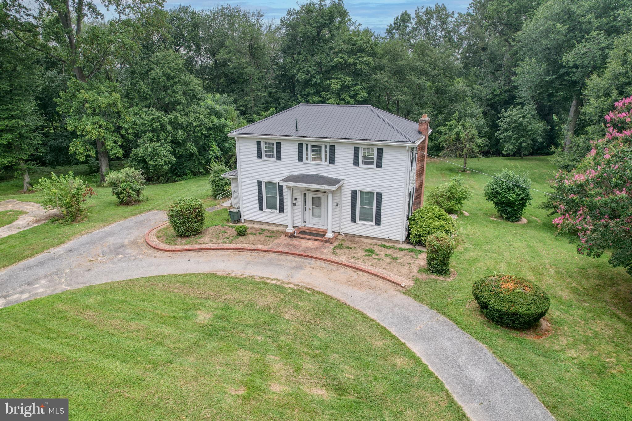 5321 Millington Road Clayton, DE 19938 - Photo 2 of 44 a house with swimming pool in front of it