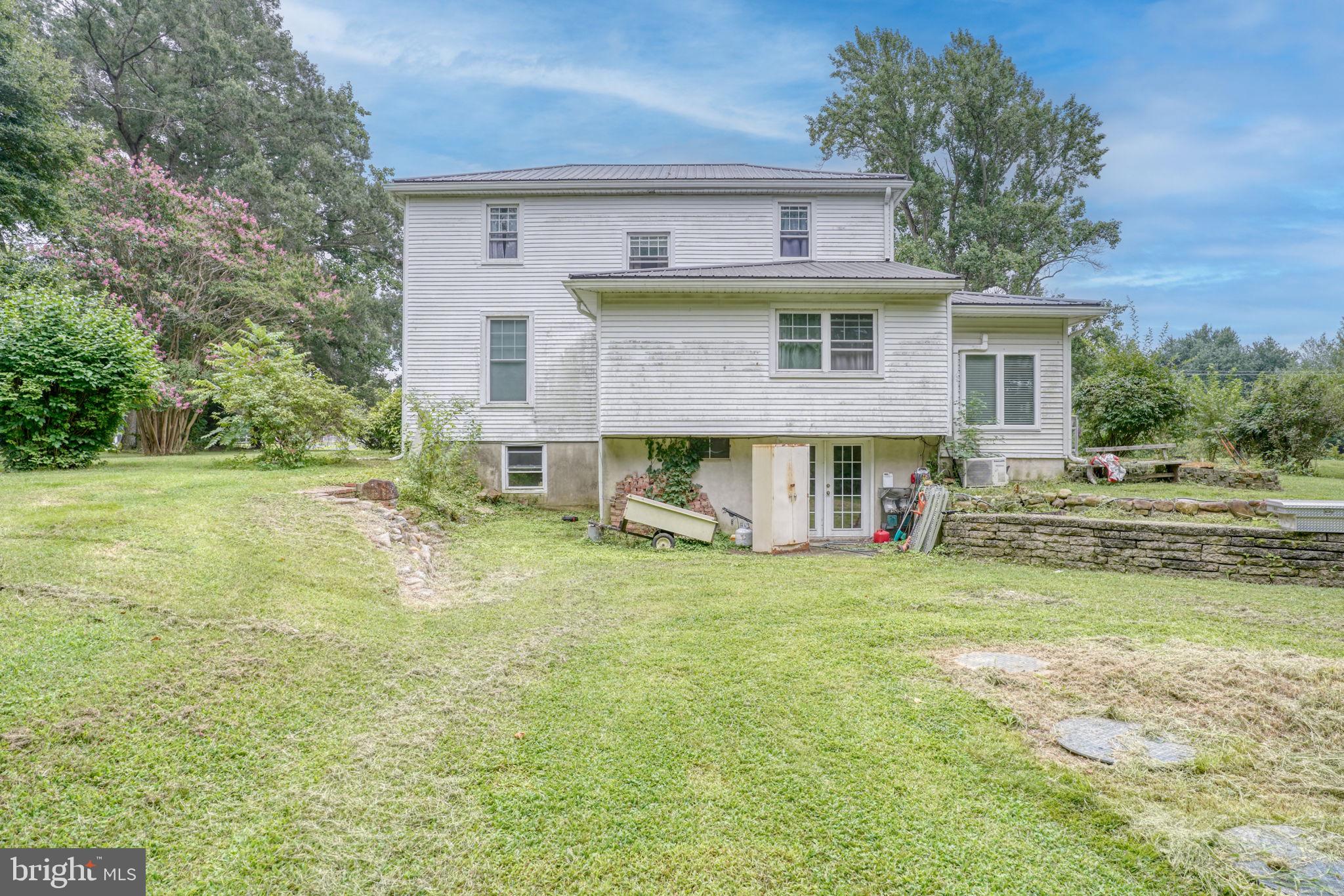 5321 Millington Road Clayton, DE 19938 - Photo 21 of 44 a view of a house with a yard