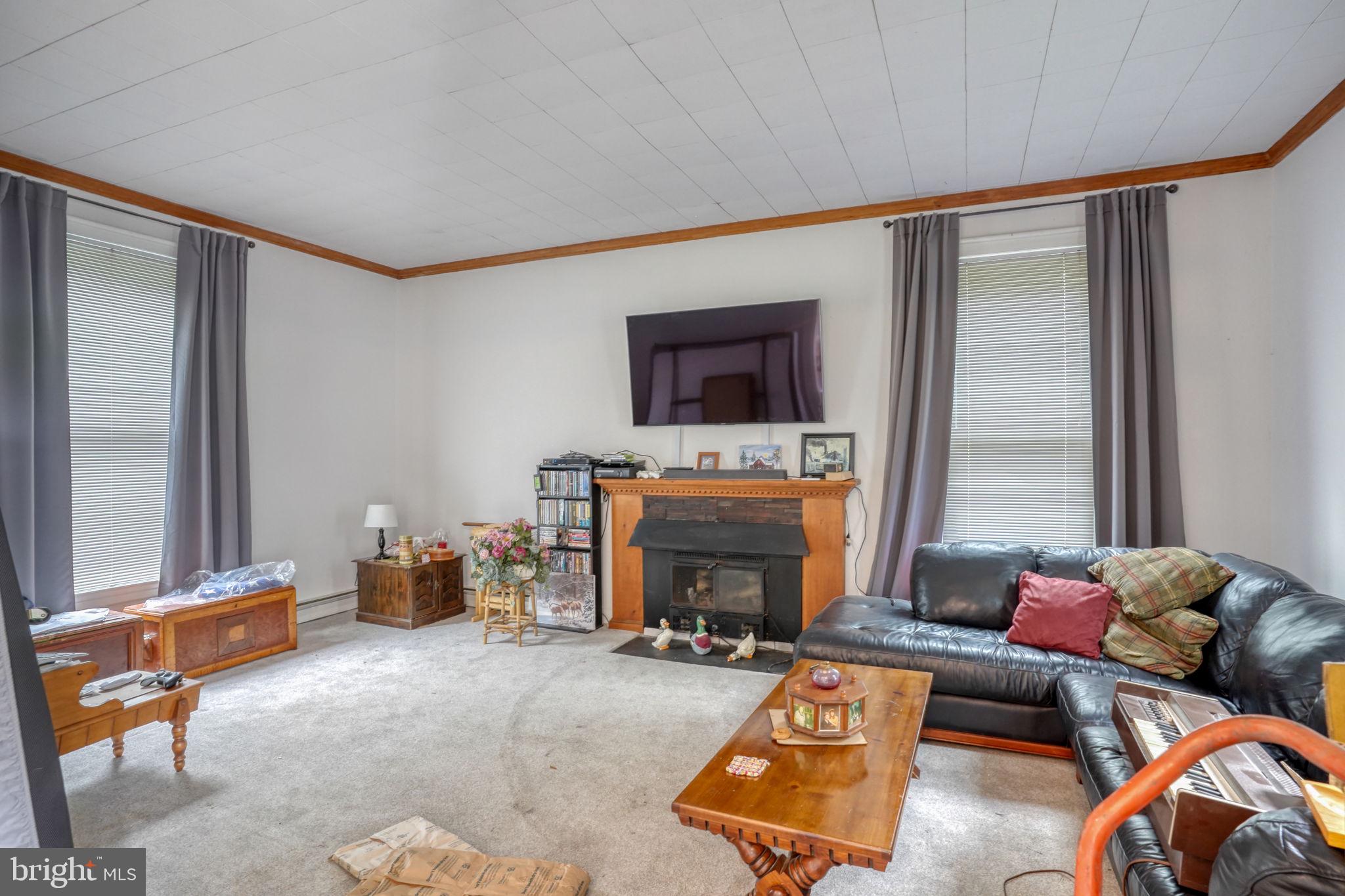 5321 Millington Road Clayton, DE 19938 - Photo 23 of 44 a living room with furniture and a fireplace
