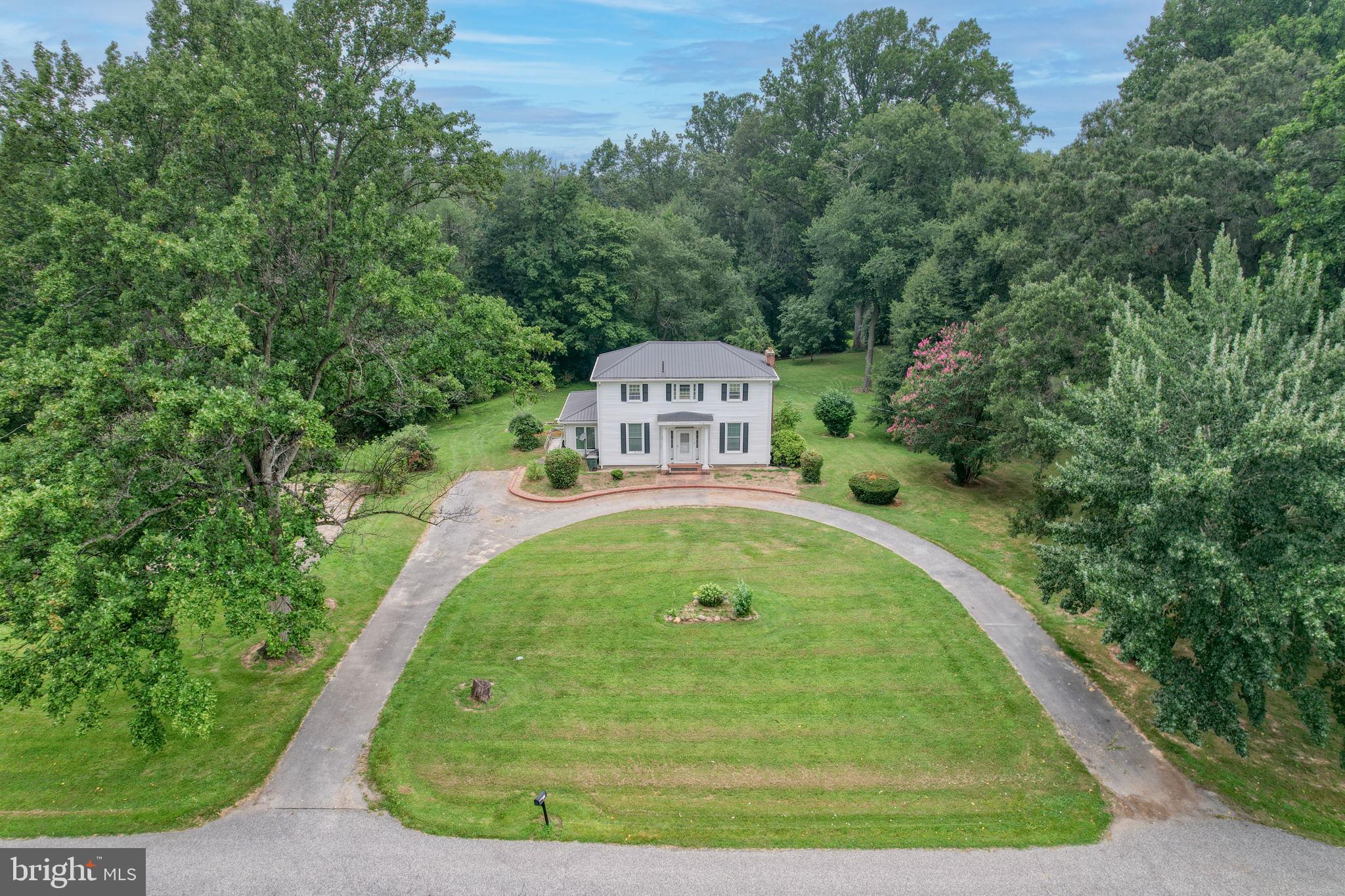 5321 Millington Road Clayton, DE 19938 - Photo 3 of 44 a view of a swimming pool with a garden