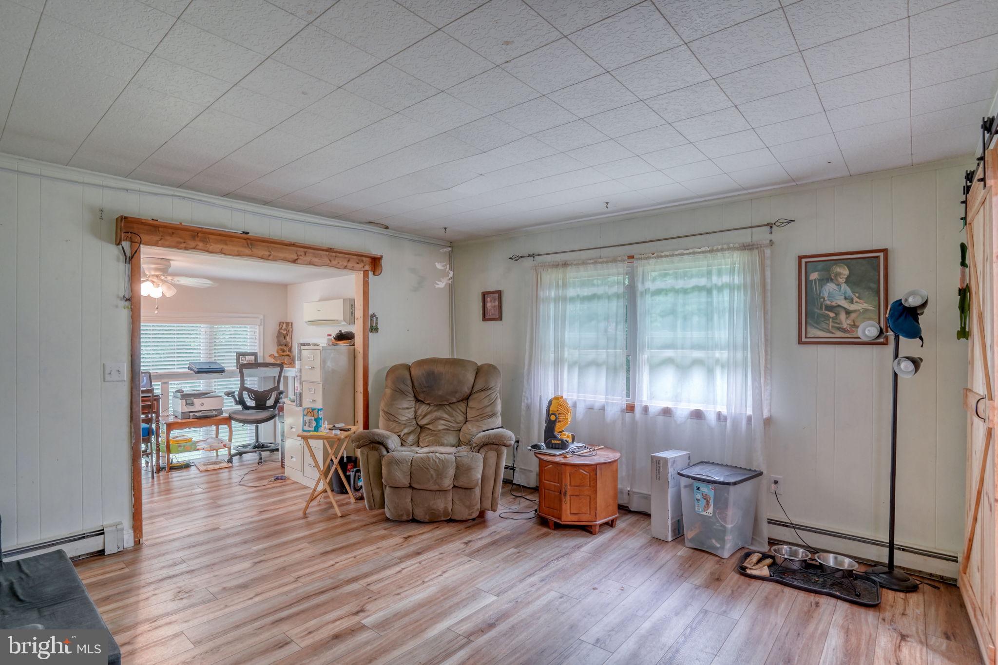 5321 Millington Road Clayton, DE 19938 - Photo 32 of 44 a living room with furniture and wooden floor
