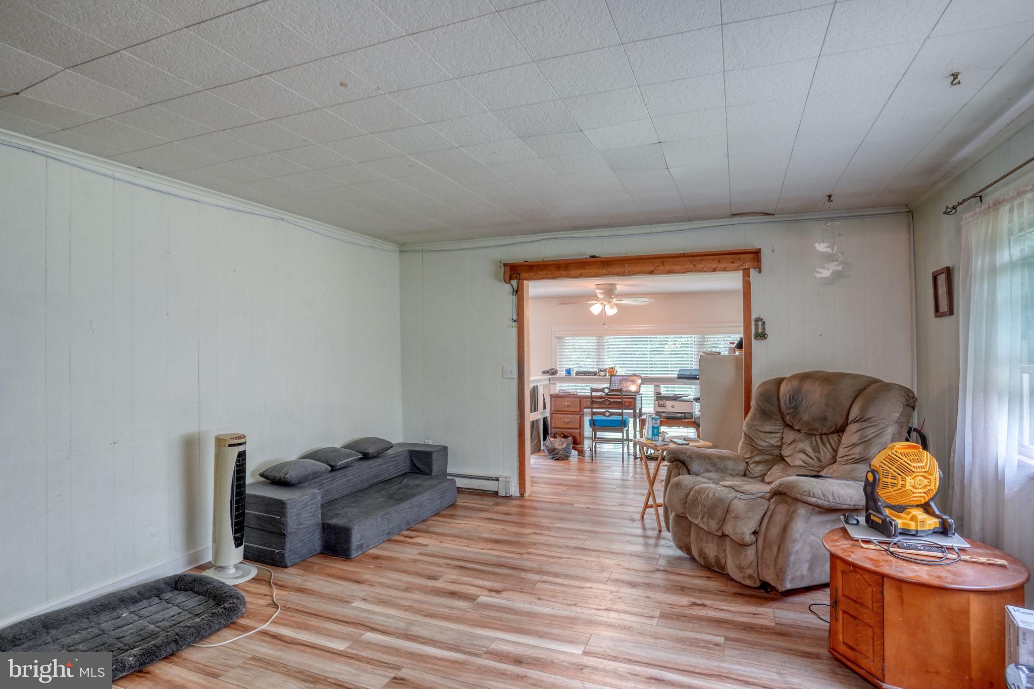 5321 Millington Road Clayton, DE 19938 - Photo 33 of 44 a living room with furniture and a large window