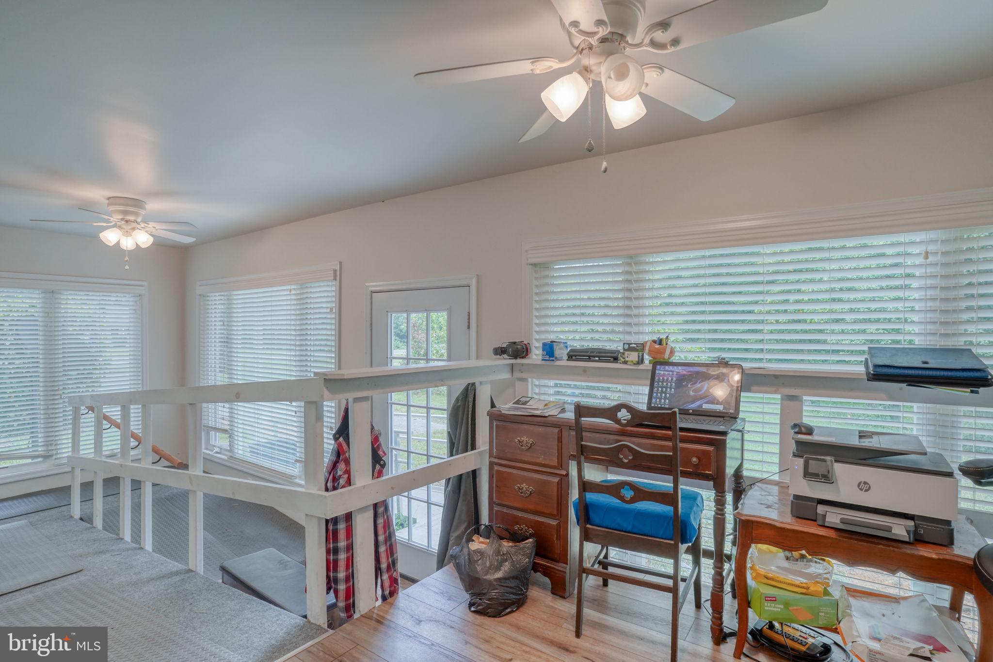 5321 Millington Road Clayton, DE 19938 - Photo 35 of 44 a bedroom with furniture and a book shelf