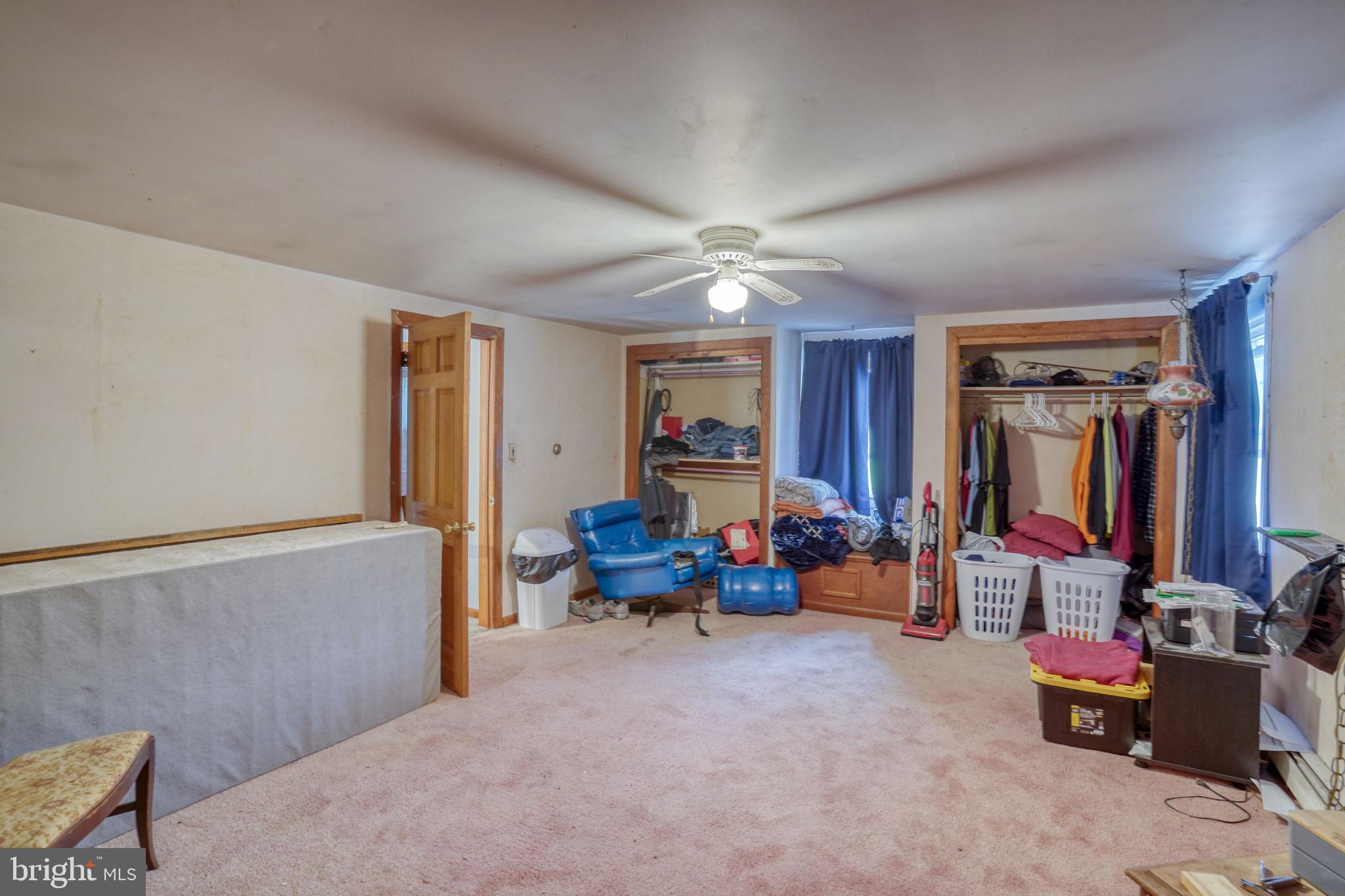 5321 Millington Road Clayton, DE 19938 - Photo 43 of 44 a living room with furniture and a chandelier