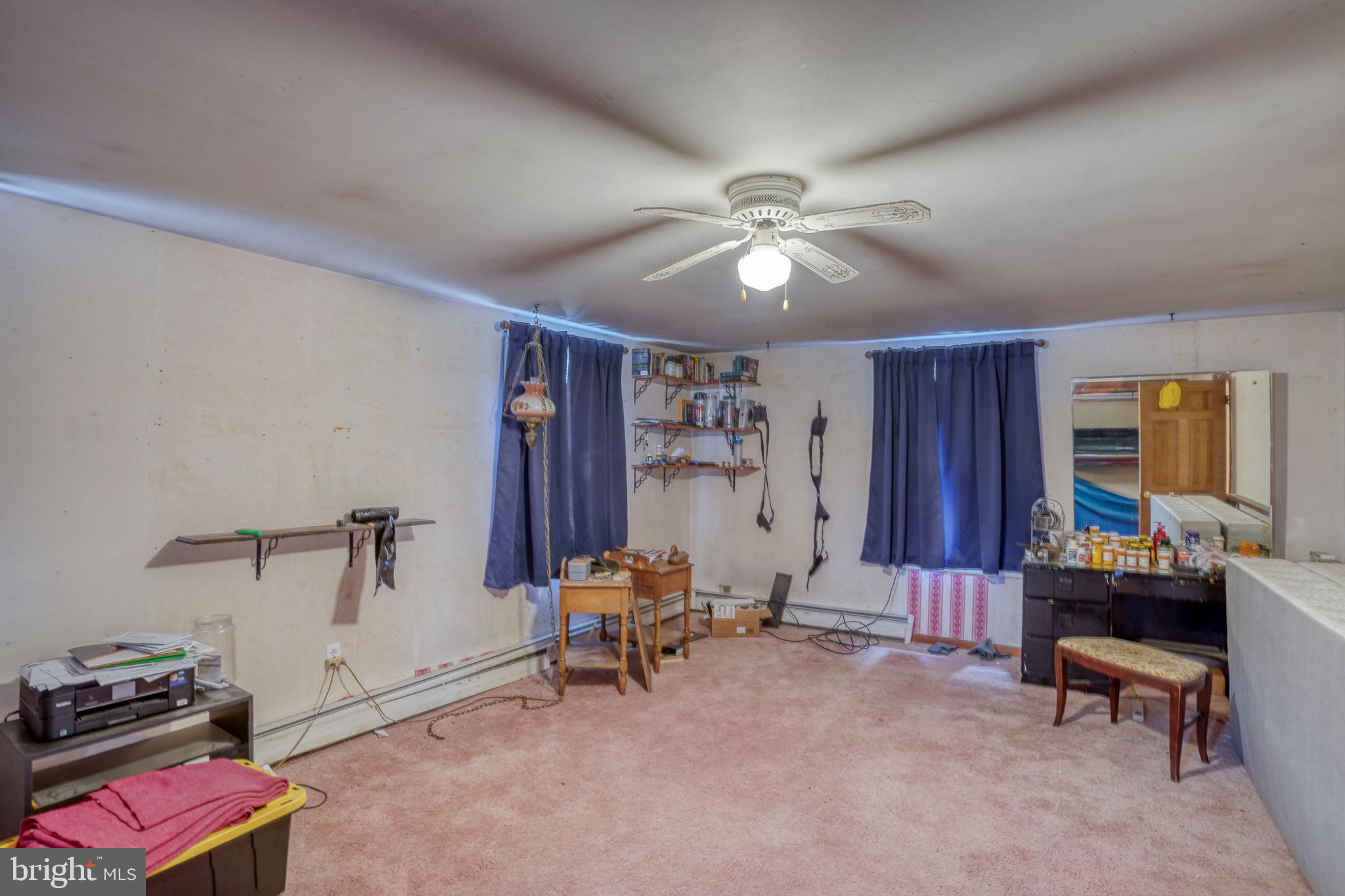 5321 Millington Road Clayton, DE 19938 - Photo 44 of 44 a view of a livingroom with workspace and a window