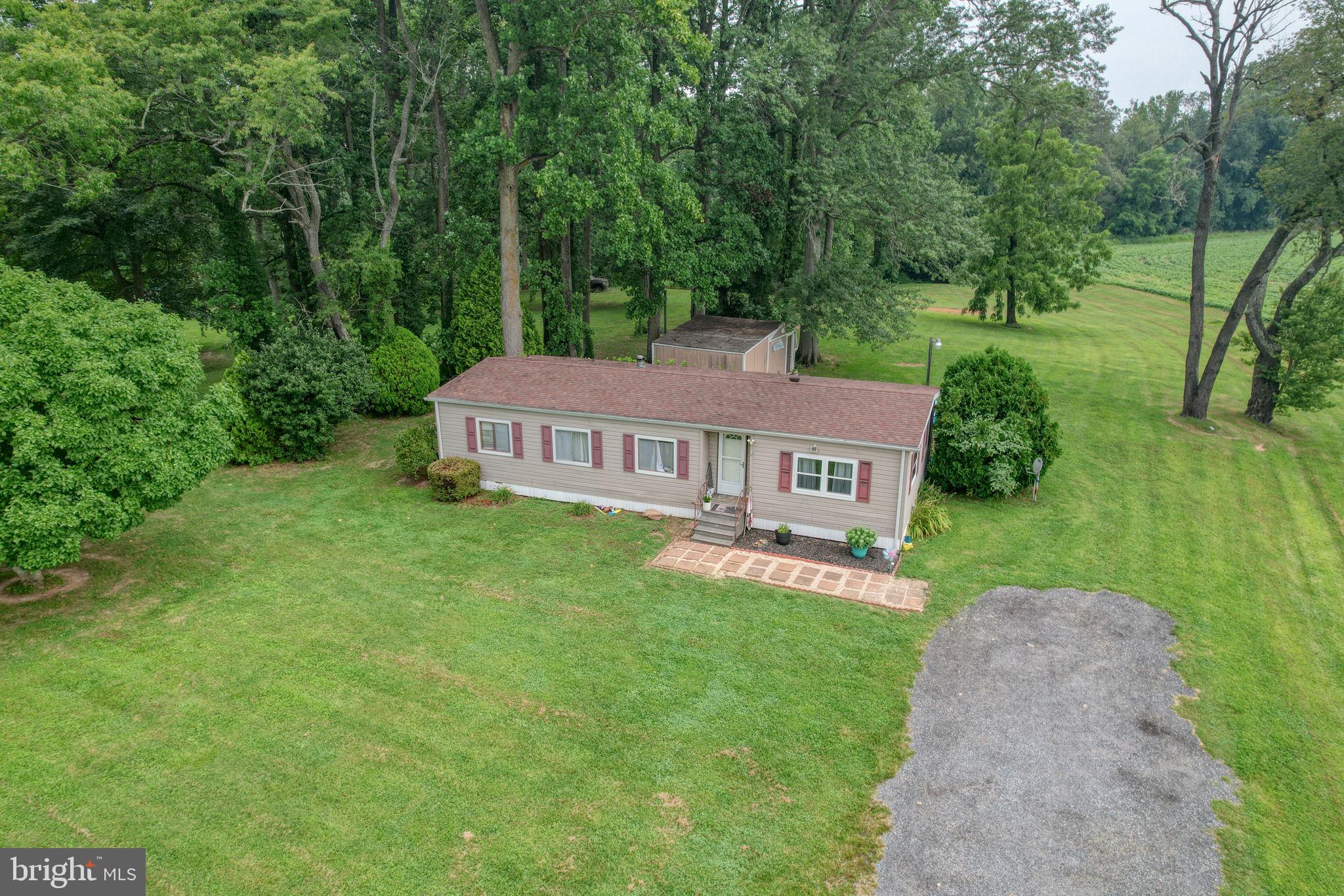 5321 Millington Road Clayton, DE 19938 - Photo 9 of 44 a view of a house with a big yard