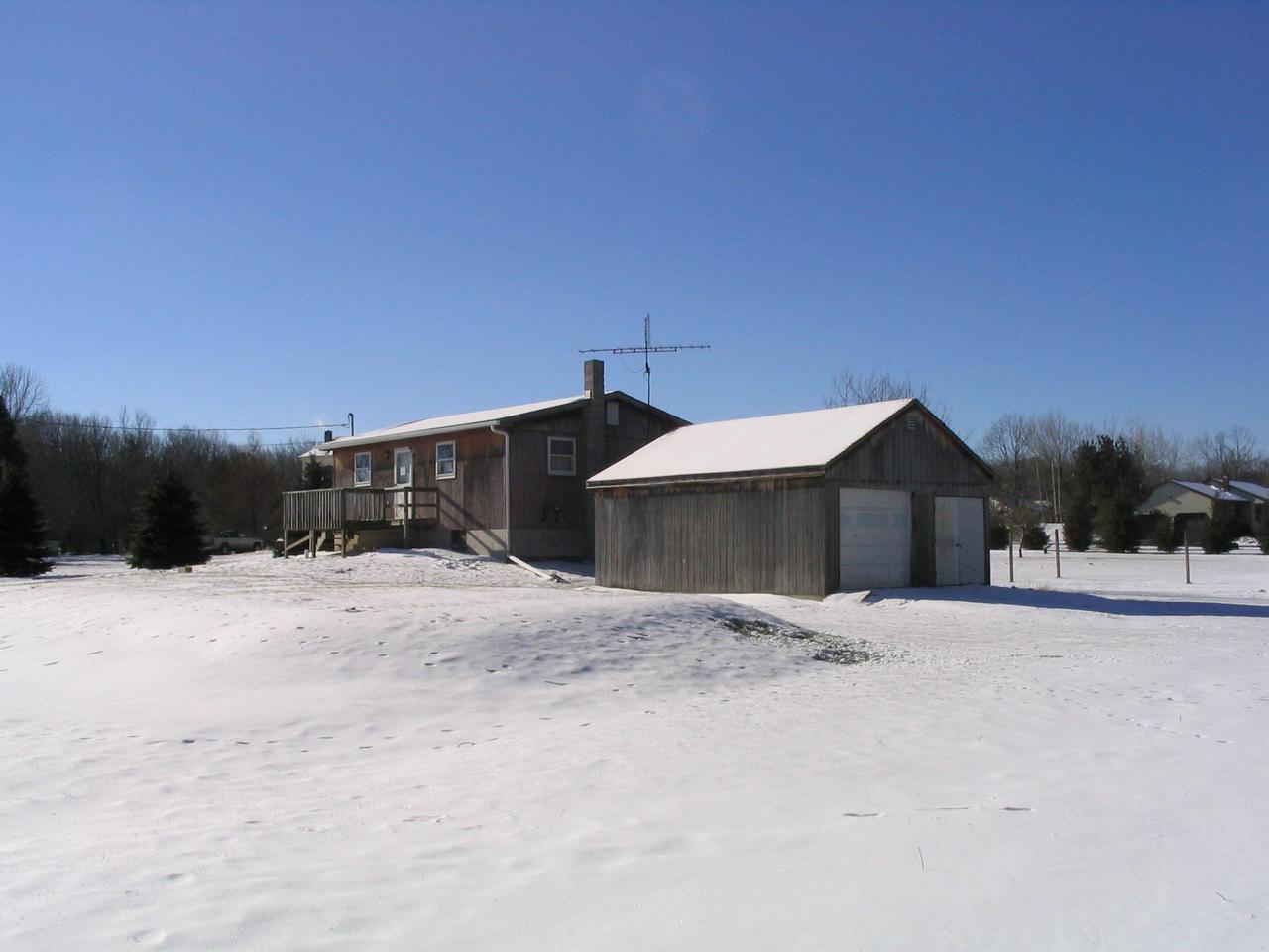8122 Cays Road Stroudsburg, PA 18360 - Photo 2 of 3 a front view of a house with a yard