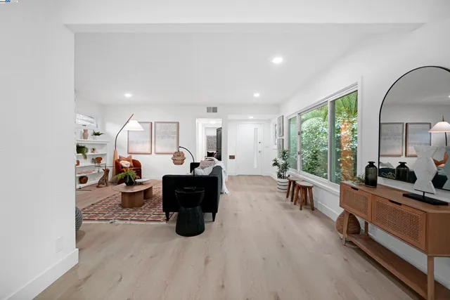 a living room with furniture and a large window