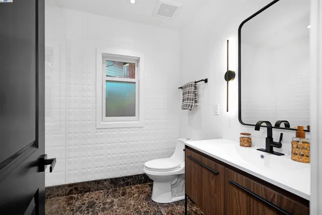 a bedroom with a bed and dresser