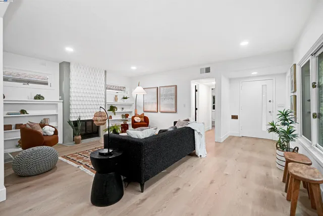 a living room with furniture or couch and a fireplace