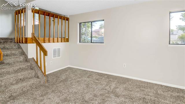 2040 South Chelton Road Colorado Springs, CO 80916 - Photo 18 of 27 Another view of the lower level family room.