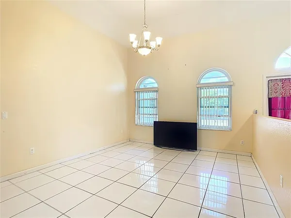 a view of wooden floor and windows in a room
